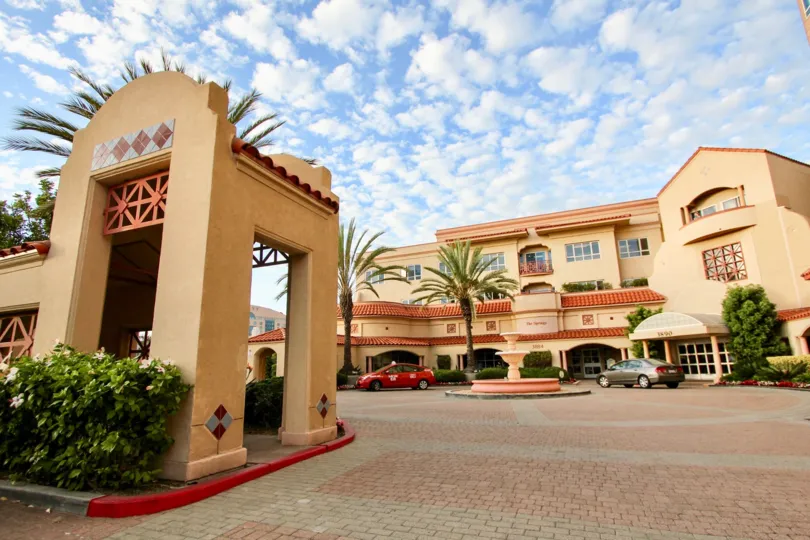 Housing complex with driveway and fountain at Pacific Regent La Jolla in University City California