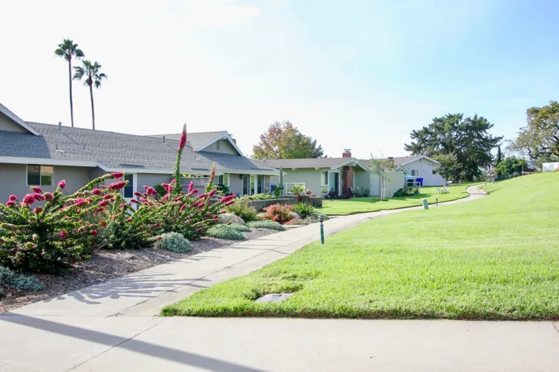 Driveway near housing and hillside at Pennant Village in University City California