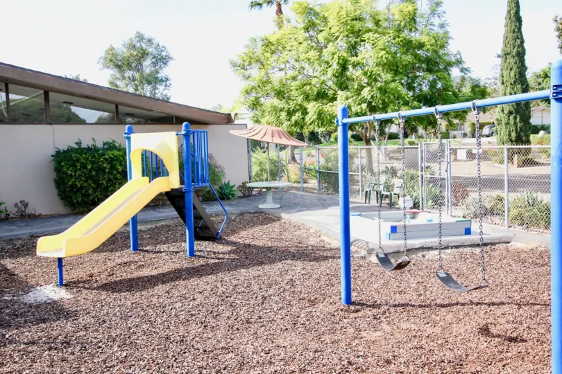 A children's park with slides and swings in Pennant Village of University City.