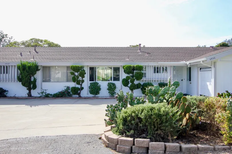 Singe story housing with parking and garden at Pennant Village in University City California.