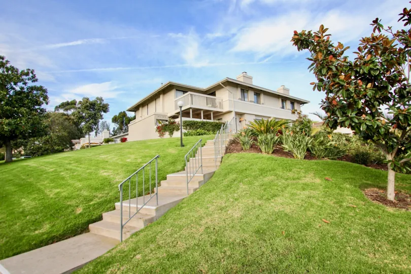 Very long stairway leading to homes on a green hillside in University City CA at Playmor Terrace West