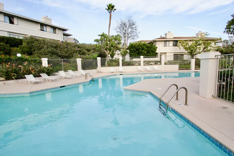 A swimming pool  with white fence in  Playmor Terrace West  of University City.