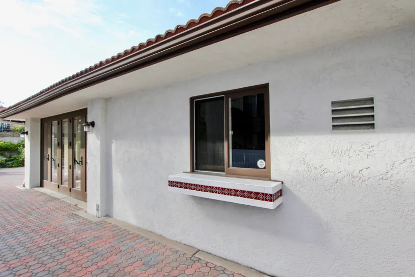 beautiful white home with park and children's playground