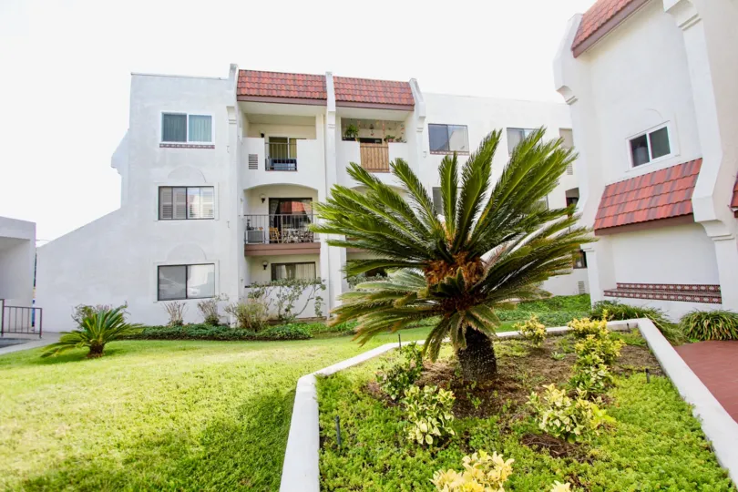 A planter among three-storey townhouses in the Regency Villas community.