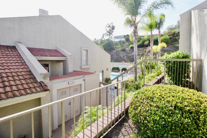 Swimming pool near residential units at Villas at University Park in University City CA