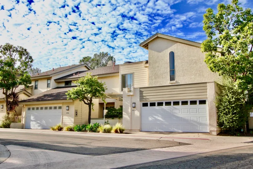 Housing with attached garages near a driveway at Vista La Jolla in University City California
