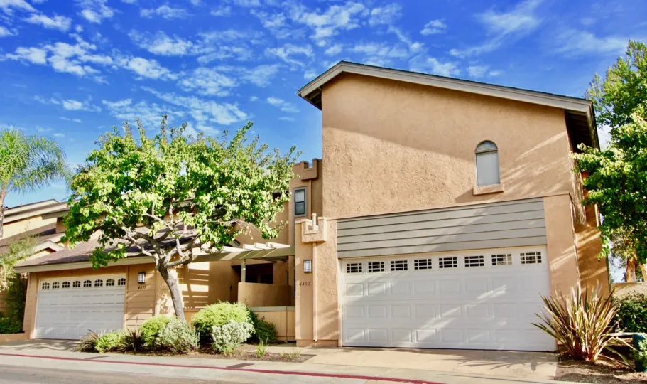 Closed garages in Vista La Jolla Village painted in beige color.