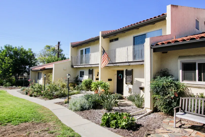 A villa in Bel Air Vista hanger with country flag and opposite to the meadow