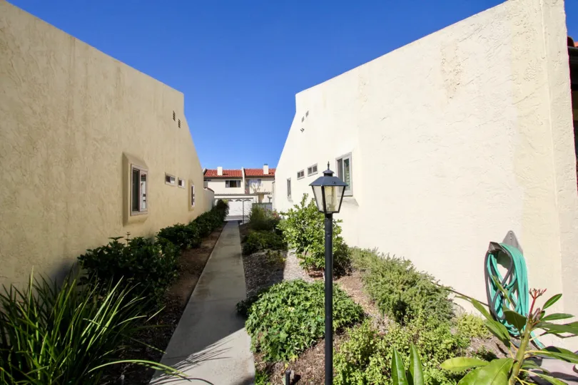 The Pathway between the two villa's has bushes and plants on the both sides