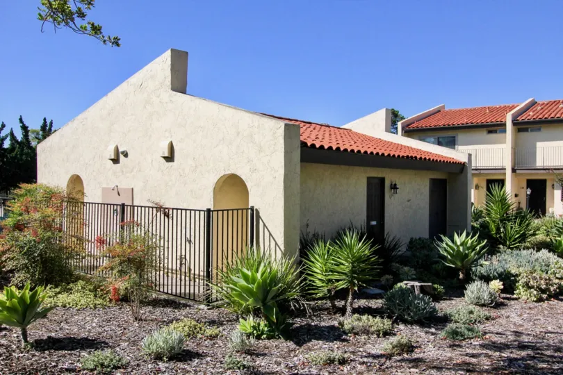 Housing with gardens and fence at Bel Air Vista in Vista California