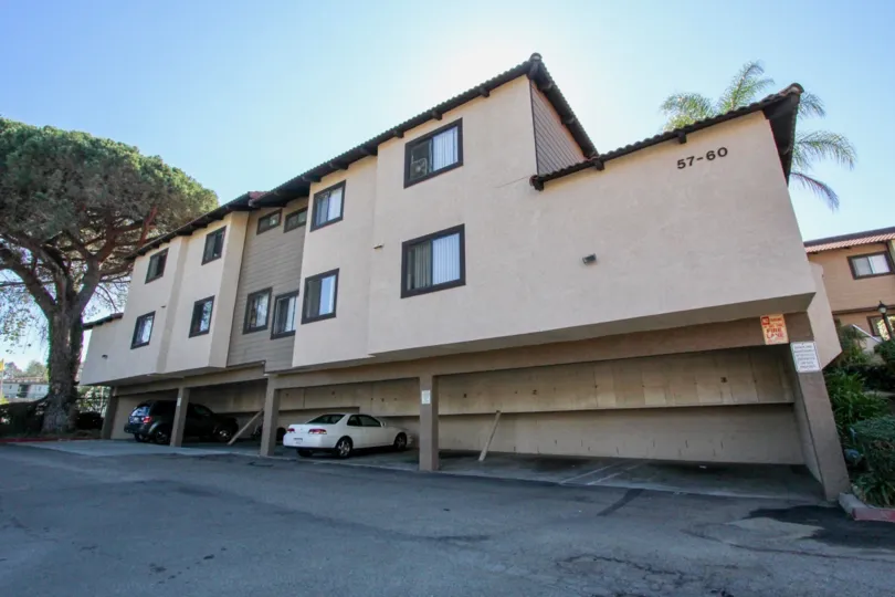 Carport and front of building view at Buena Vista Townhomes in Vista, CA