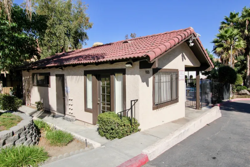 A sunny day at Buena Vista Townhomes with a beautiful home