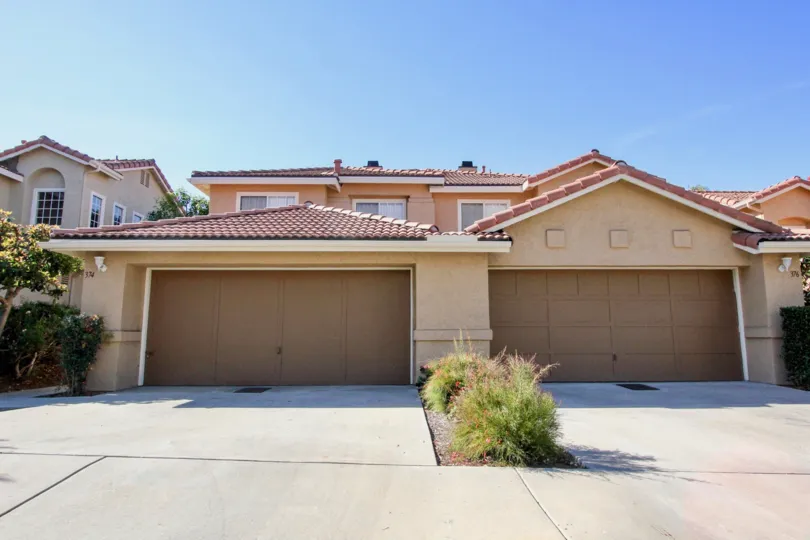 Homes with attached garages with driveways at California Capri in Vista California.