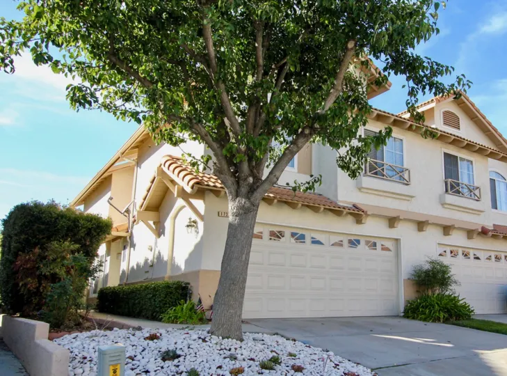 two story townhmoe in a great Community with a pool and garage