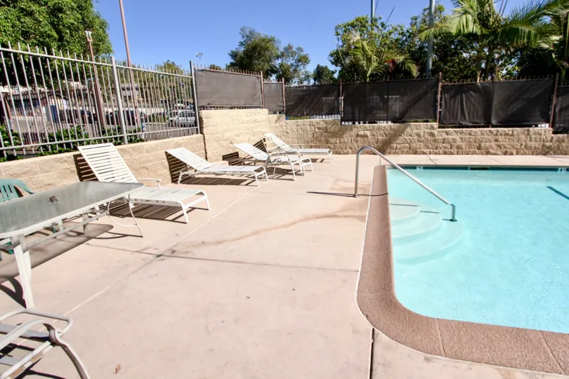 Bright, sunny afternoon by a clear pool in Vista, California.