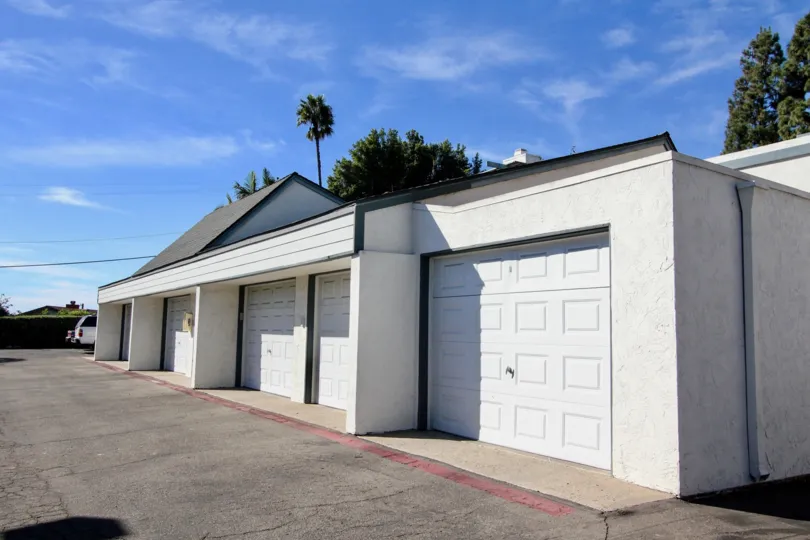 A sunny day in the area of Copper Hill, parking area, garage, trees