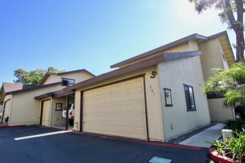 A clear sunny day in Marlin Terrace community with a beautiful house with a car parked.