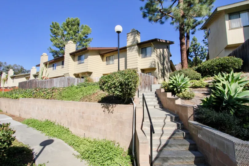Cements stairway leading past plants into the Marlin Terrence in Vista CA