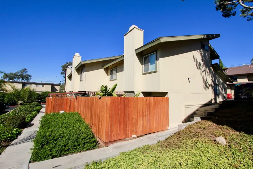 Sunny backyard sidewalk of he Marlin Terrace complex in Vista, California
