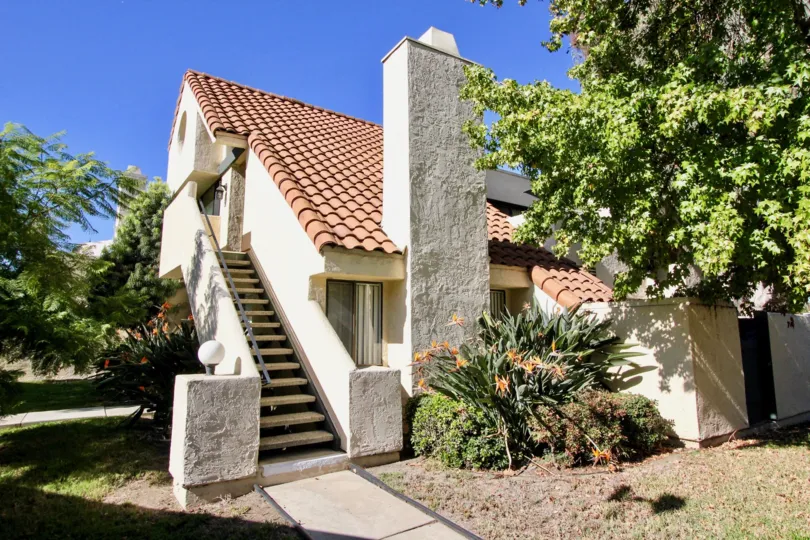 White building with a Spanish style tile roof in Melrose Park, CA