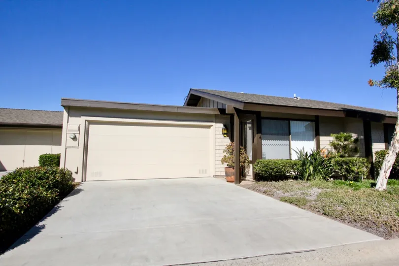 Pretty lawn and a spacious garage to enjoy at the Nob Hill residence in Vista, CA