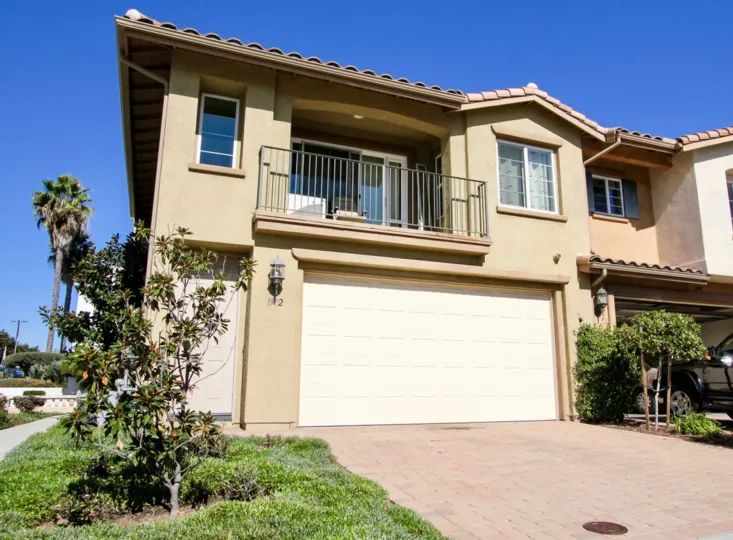 Parking and amenities area with cornered facing home in Oak Drive Villas.