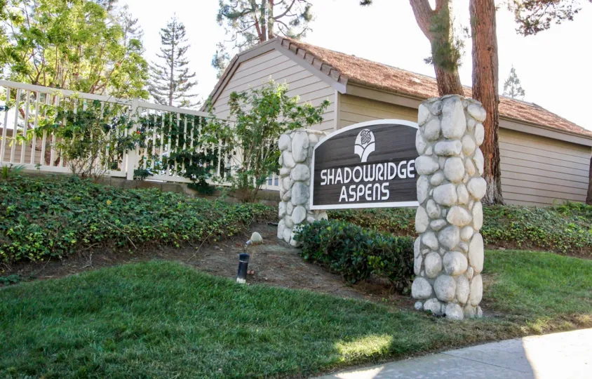 A sign saying at the entrance to Shadowridge Aspens in Vista, CA