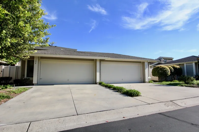 A sunny day in the area of Shadowridge Greens, garage, parking lot, door, tree