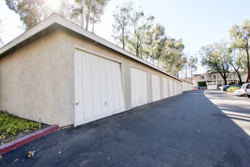 Garages near parking lot at The Park in Vista California