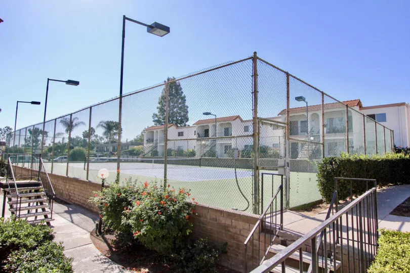 Lawn Tennis court with fence and focus lights in Vista Hills Estates.