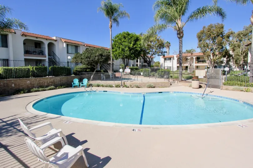 The bean shaped pool sits empty on a sunny day in the Vista Hill Estates condos.