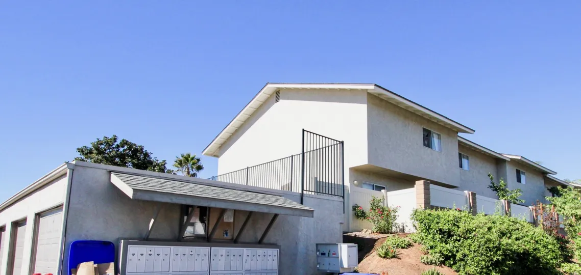 Postal Boxes is placed in the House at the Vista Ladera and bushes are in the sand