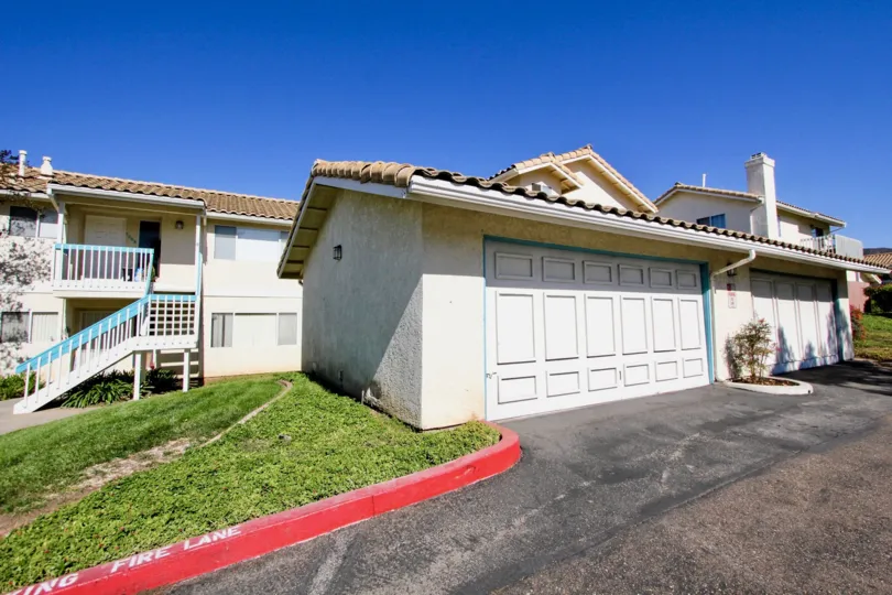 Garages between housing and a driveway at Vista Palomar in Vista California