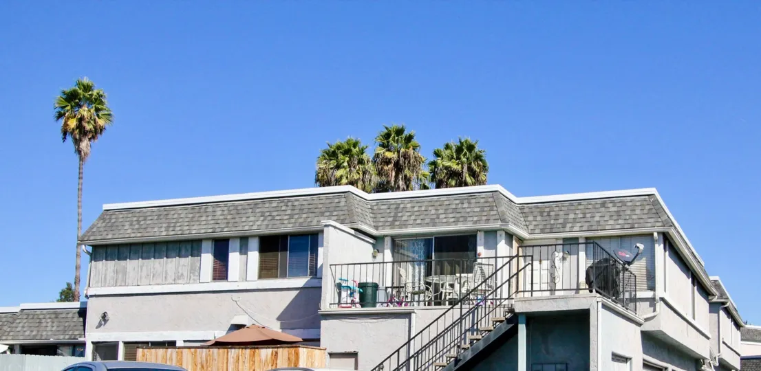 Bright and sunny day in front of a building in Vista Park Villas a town in Vista, California.