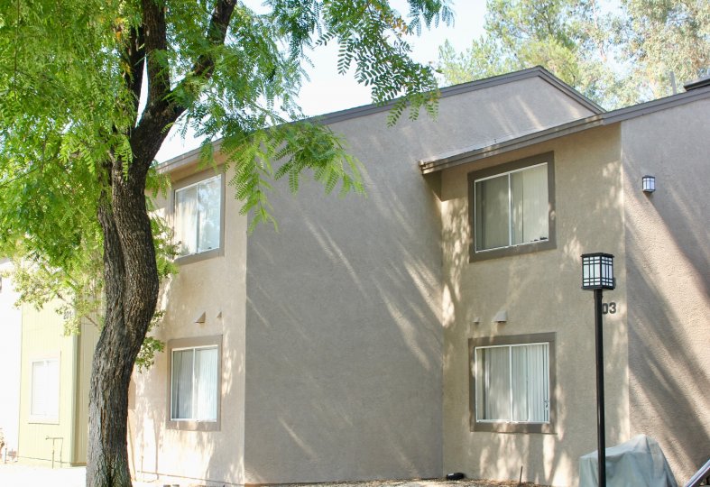 Crown Villas apartments with her smooth finish and outdoor lamp. Corona, California