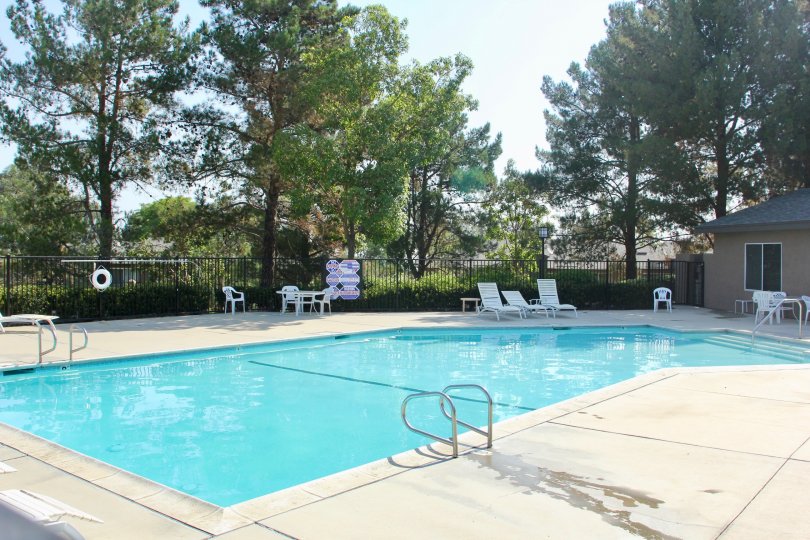 A bright day swimming pool with all recreational amenities nearby