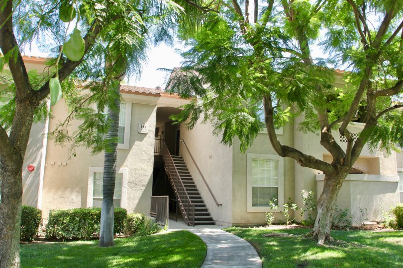 A housing with a second floor entrance in Sonata at Canyon Crest community.