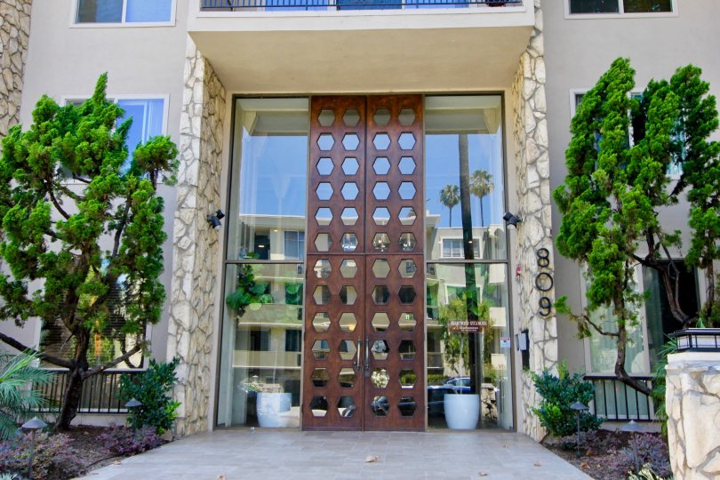 Beautifully ornate wood and glass entryway to Brentwood Sycamore in Brentwood California