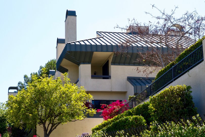 Century Hill is a midcentury designed building with metal accents and stucco walls