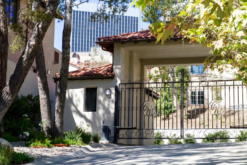 The gates leading to Century Woods have monograms of the community name