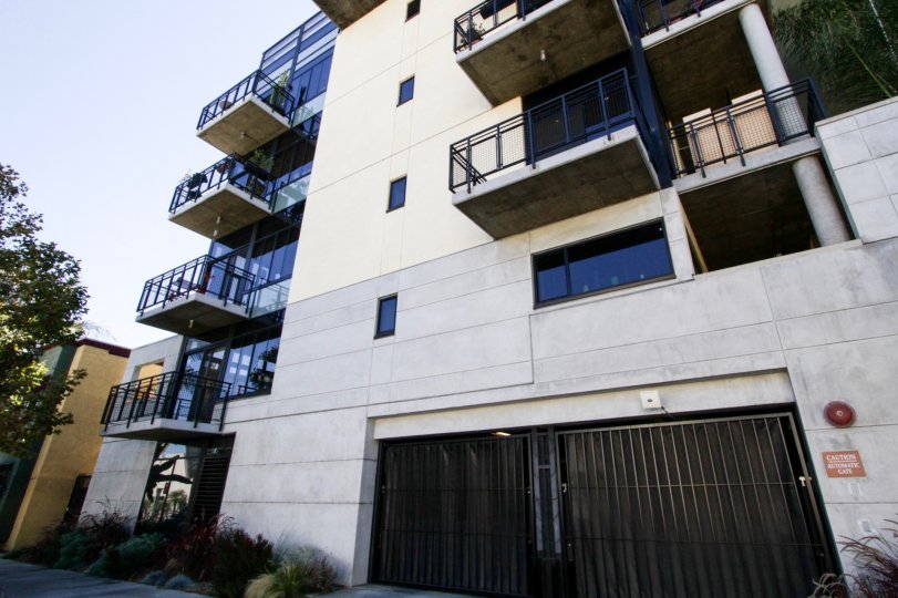 Glass walls lead to corner balconies at Temple Lofts
