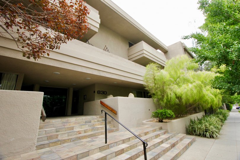 white stairs and a handrail leading up to 630 Idaho in Santa Monica