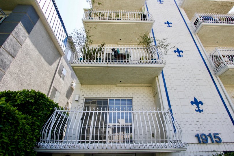 a white and blue building in chateau Fleur De Lis in a sunny day