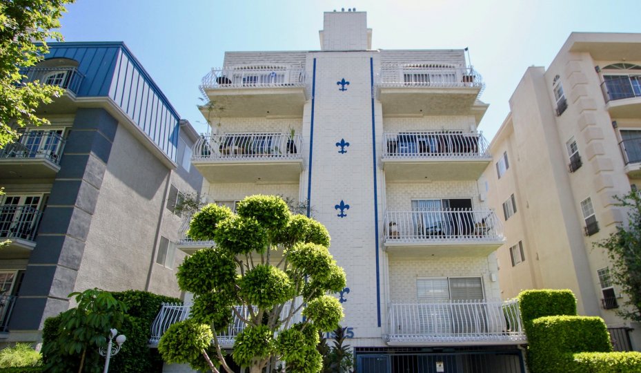 The sun rises above an apartment building in Chateau Fleur De Lis California.