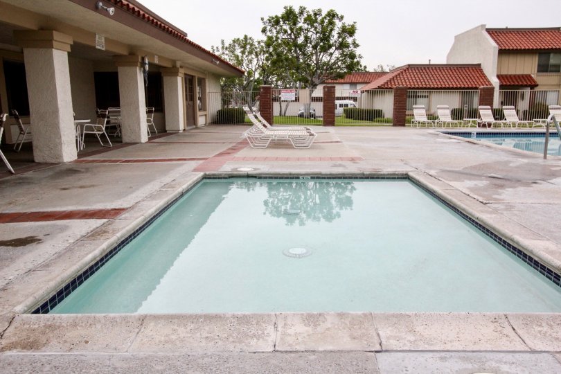 The place in Casitas California has both children's and adult's swimming pool with seating chairs