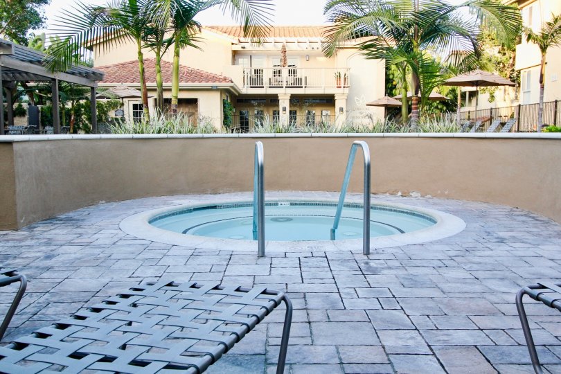 A metal railing with two sides leading to a hot tub in Ritz Pointe in Dana Point CA
