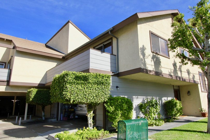 A condo with overhang and balcony on a sunny day in Stanford Plaza in Garden Grove, California.