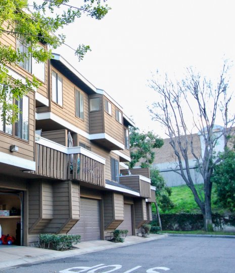 THE FLAT WHICH IS IN GARDEN GROVE, SHOWS THE ROADWAY WITH LOT OF TREES, AND PLANTS