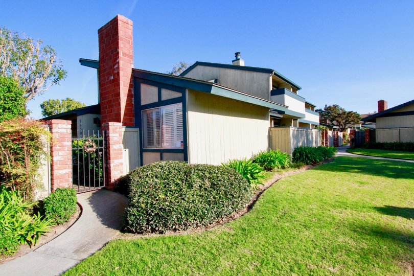 Extraordinary view of green lawn in front of villa in Harbor Pines of Huntington Beach