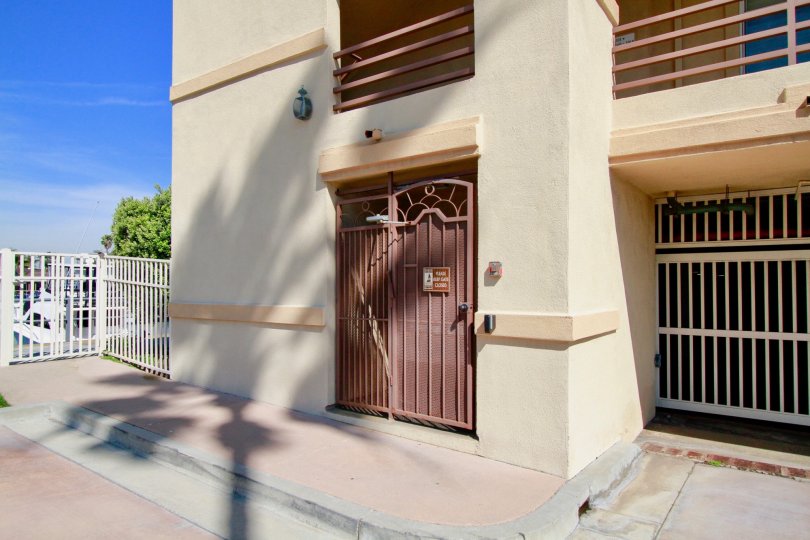 Harbour Bay Club Huntington Beach California front looks like prison model gates with brown color